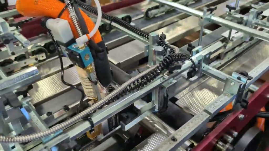 digi-mollPAK System with Leary Glue System – Running two up folding carton and taping