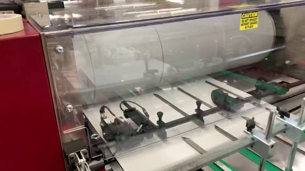 FlexCut Rotary Die Cutter with Stripping, Folding, Gluing Pocket Folders at 6k/hr